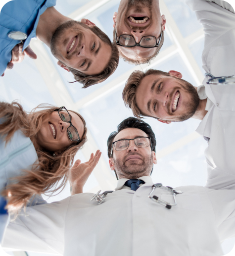 Young Doctors As Team Stack Hands Together Motivation 1